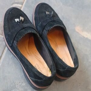 Womens Clarks Black Suede Loafers with Brown accent line above black rubber sole